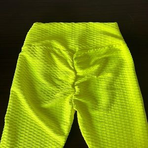 Brazilian scrunch butt leggings in neon yellow and various colors.